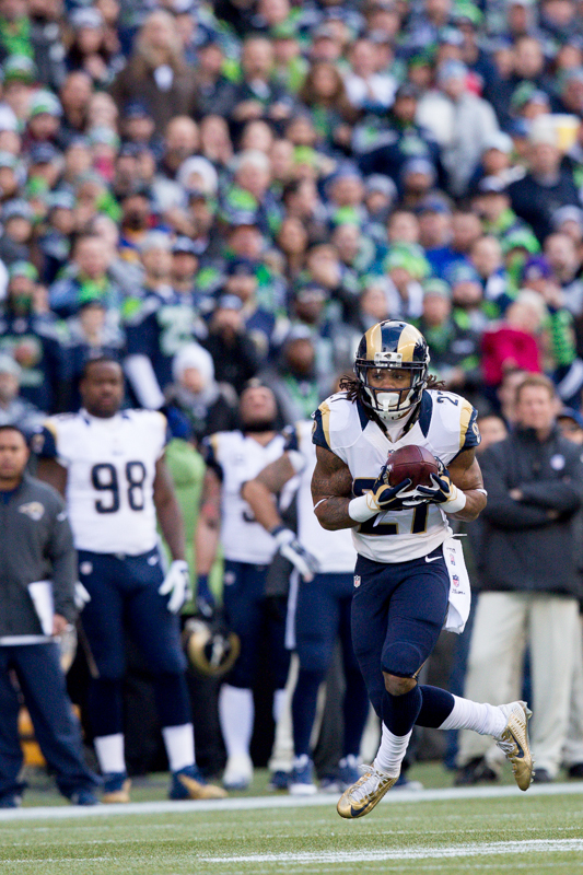 Rams running back Tre Mason picks up four yards in the first quarter.