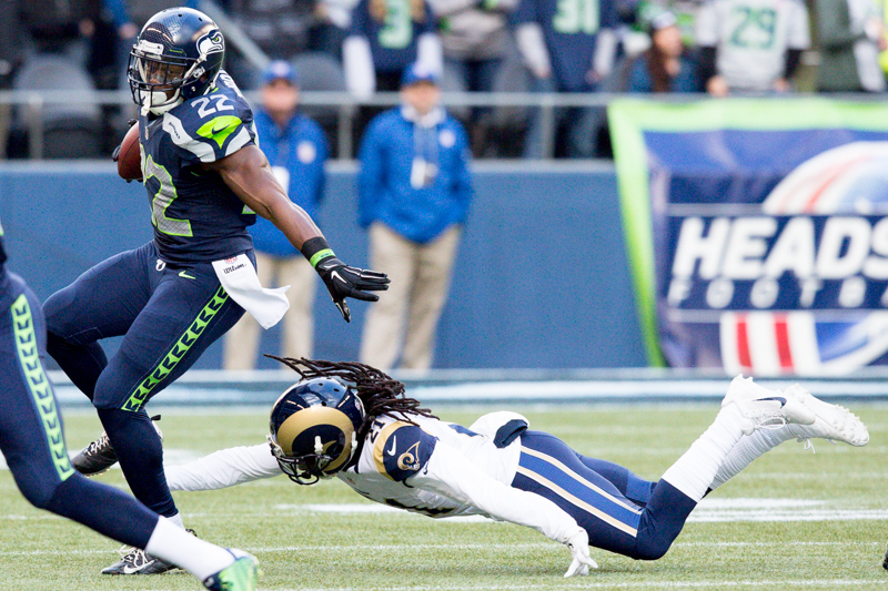 Seahawks' running back Robert Turbin evades a Rams defender on a run in the first quarter.
