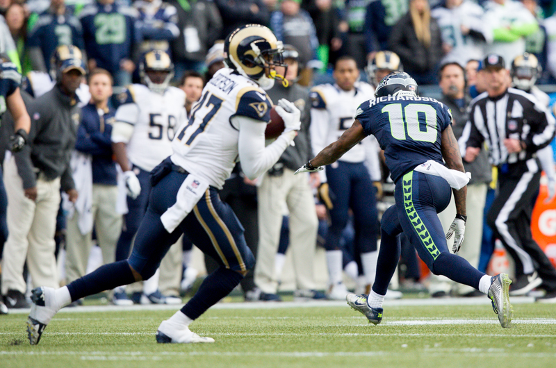 Hawks' receiver Paul Richardson gets his bearings after an overthrown pass intended for him was intercepted by Rams' cornerback Marcus Roberson.