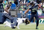 Marshawn Lynch evades capture from a Rams defender in the second quarter.
