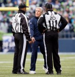 Seahawks' coach Pete Carroll debates a call with referees in the third quarter.