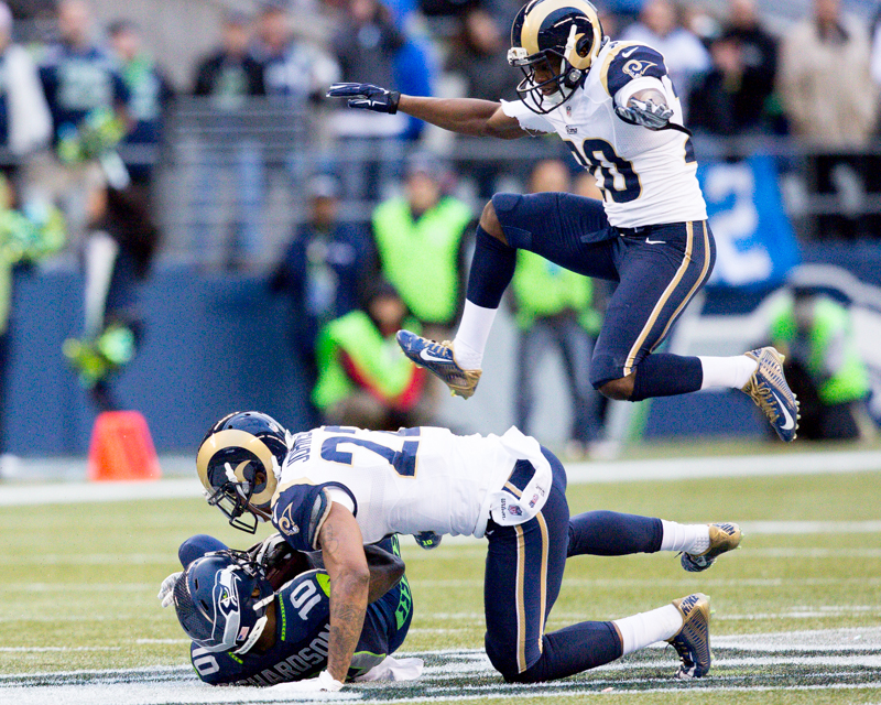Rams defender Lamarcus Joyner jumps over a tackled Paul Richardson in the third quarter.