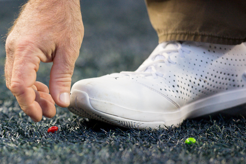 Stadium staff pick up Skittles from the end zone after Marshawn Lynch's 9-yard touchdown run in the fourth quarter.