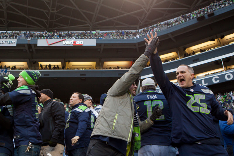 Fans cheer after Marshawn Lynch's 9-yard touchdown run in the fourth quarter.