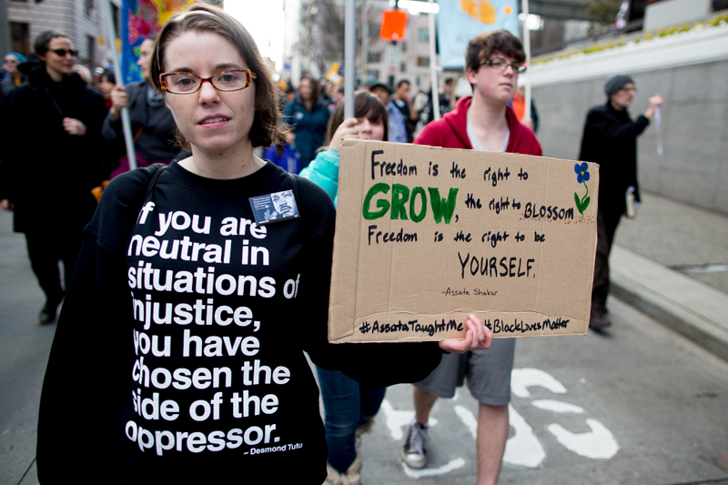  Photo by Jeremy Dwyer-Lindgren Thousands gathered peacefully in Seattle streets Monday both