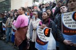 Participants listen to post-march speeches at the Federal Building in downtown Seattle.