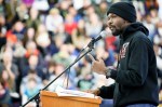 Activist and Ferguson-based organizer Jelani Brown speaks to the crowd at Garfield High School before the march.