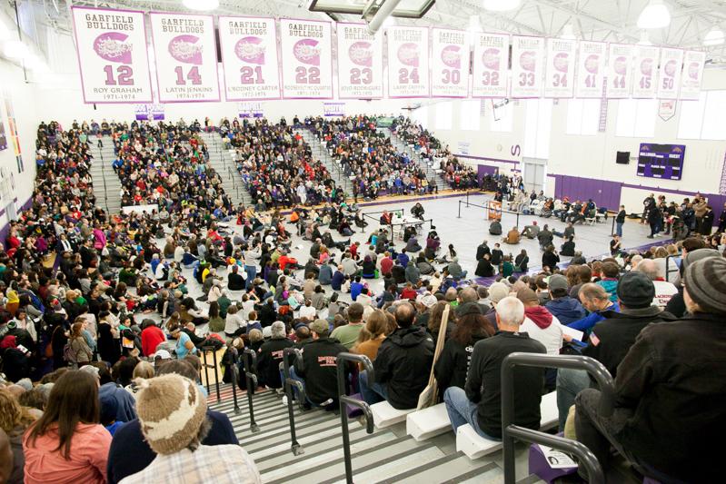 Speakers rally the crowd inside Garfield High's gymnasium.