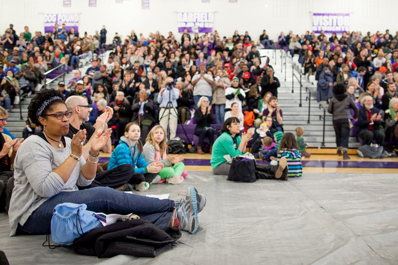 People cheer a speaker during a pre-march rally.