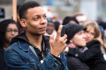 Members of the crowd listen to pre-march speakers outside Garfield High.