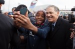 A girl takes a selfie with Governor Jay Inslee at a pre-march rally.