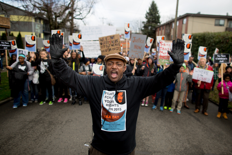Shouting "Hands up, don't shoot!" marchers make their way through the Central District.