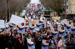 The march stretches for multiple blocks as it winds its way down Yesler Way.