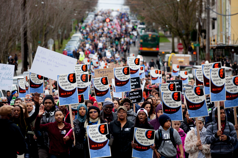 The march stretches for multiple blocks as it winds its way down Yesler Way.