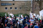 Marchers pass by the King County Youth Detention facility.