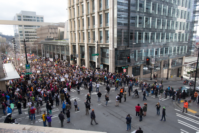 Thousands pause in front of the Seattle Police headquarters in downtown.