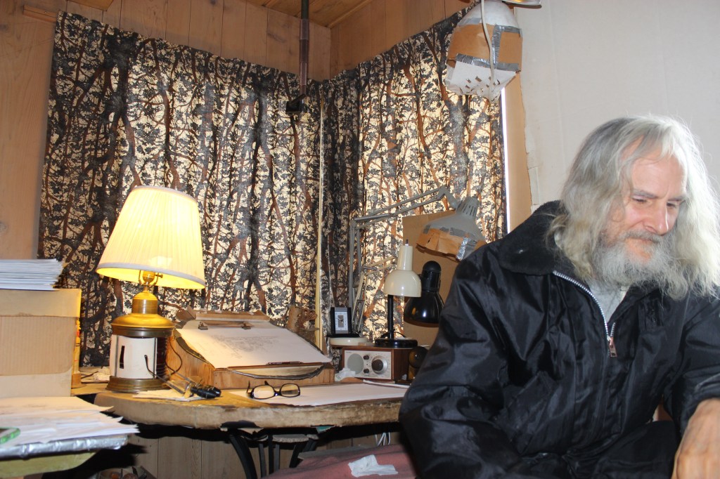 Bickford in his living room, where he spends most his time drawing vampires nowadays. Photo by Kelton Sears.