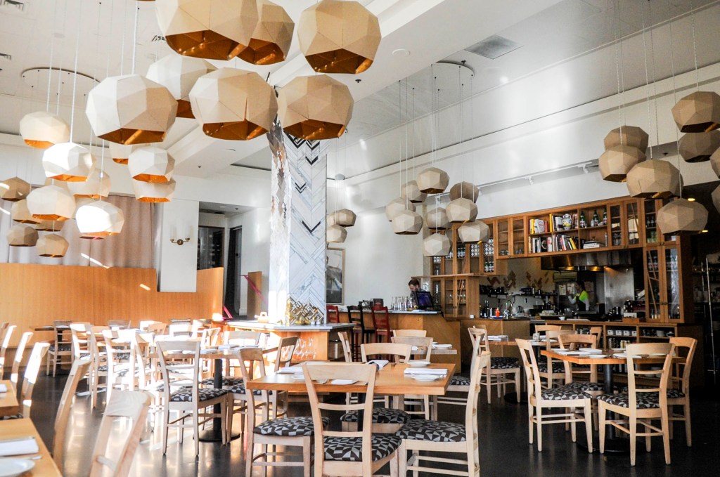 Left: Vespolina’s main dining room. Right: The bar at Hommage.