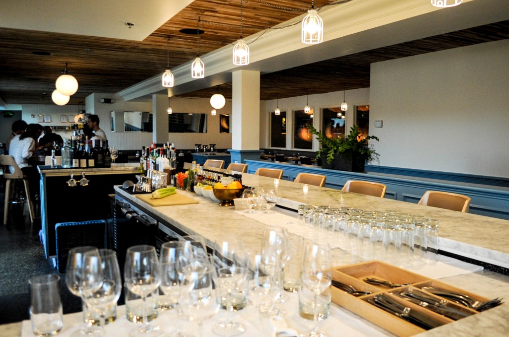 Left: Vespolina’s main dining room. Right: The bar at Hommage.