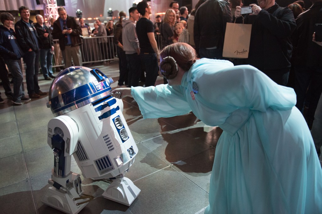 One fan couldn't resist replaying a pivotal part of the movie with a replica R2D2 robot (he scooted around the whole evening beeping and booping).