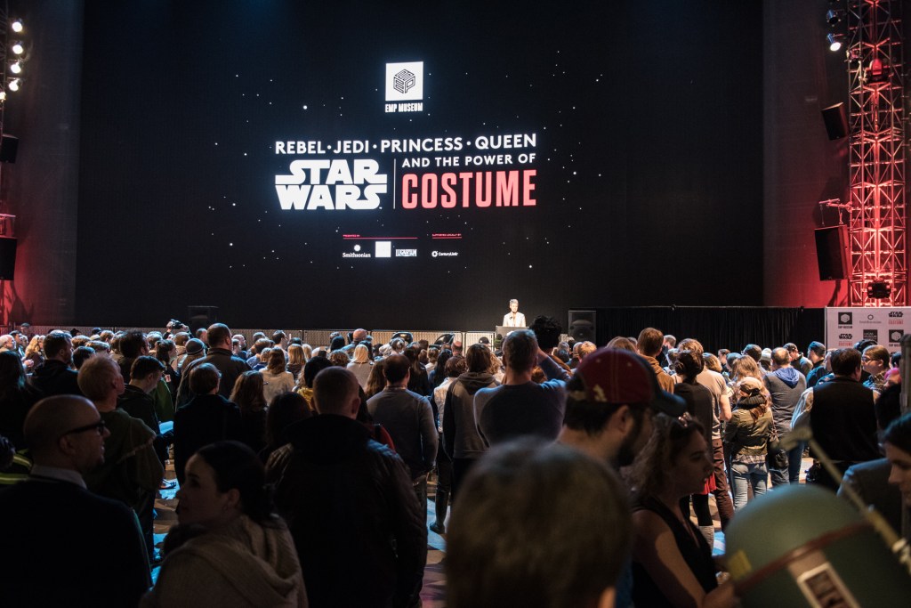 A crowd gathers to hear Anthony Daniels speak.