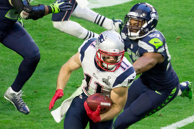 Julian Edelman evades Seattle defenders in the first half.