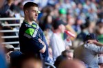 A Seattle fan reacts to New England's first touchdown.