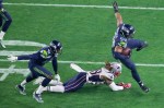 Seattle linebacaker Bobby Wagner intercepts Tom Brady in the first half.