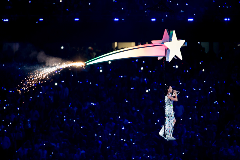 Katy Perry improbably flies over the crowd during the halftime show.