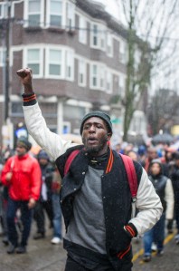 Matthew Wyatt leads protesters along East Pike Street, chanting "Black Lives Matter." Hundreds marched Capitol Hill for the Walking While Black: Always Dangerous Until Proven Otherwise protest on Saturday, Feb. 7, 2015.