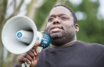 Chad Goller-Sojourner, organizer of the Walking While Black: Always Dangerous Until Proven Otherwise march in Seattle, speaks to a crowd of around one hundred protesters at Cal Anderson Park on Feb. 7. Goller-Sojourner organized the event to protest racial profiling by Seattle police.