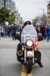 A Seattle police officer waits for protesters in the middle of the road. The SPD cleared the roads and conducted traffic during the Walking While Black march on Feb. 7, 2015 which protested racial profiling by Seattle police officers.