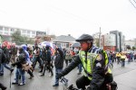 SPD Sergeant Fred Ibuki rides along the route of the protest, making sure it stays peaceful. Many marched through Capitol Hill protesting racial profiling of the Seattle Police.