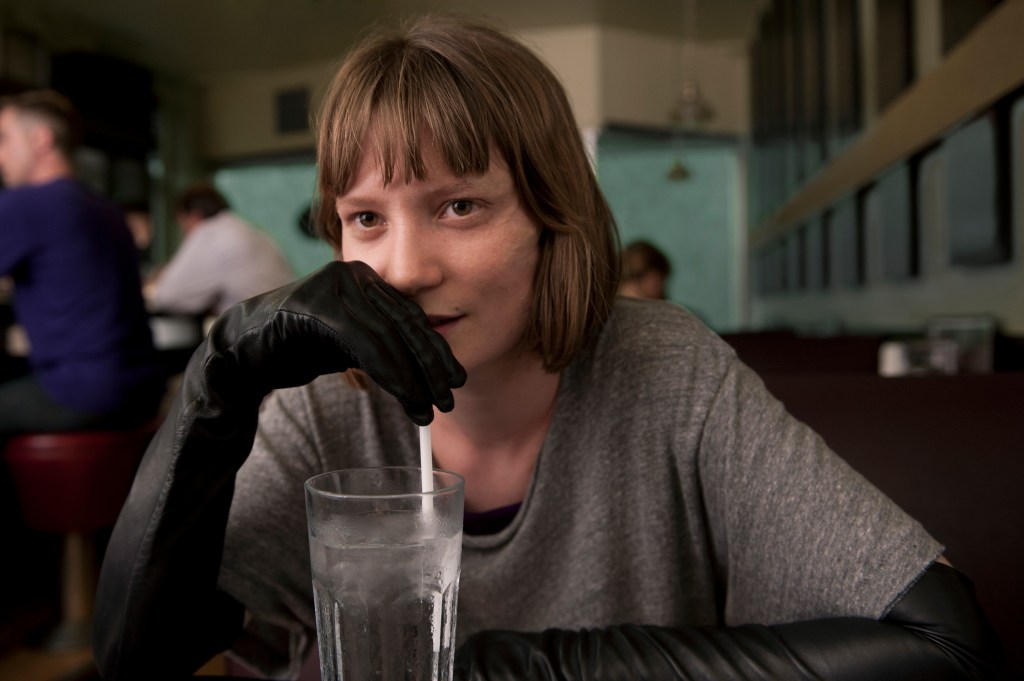 Mia Wasikowska as Moore's chore whore.