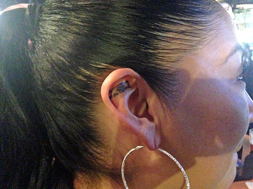 Bartenders’ matching Seahawks tats.