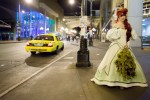 Melinda Rose, dressed as Ariel from 'Little Mermaid,' waits for her ride Friday night.