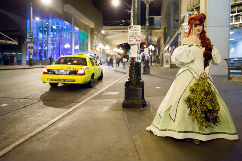 Melinda Rose, dressed as Ariel from 'Little Mermaid,' waits for her ride Friday night.