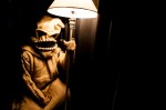 Oogie Boogie from 'Nightmare Before Christmas' rests beside a lone lamp backstage.