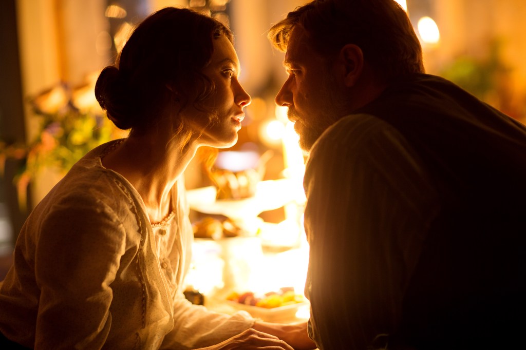 Grief turns to something else: Kurylenko and Crowe.Mark Rogers/Warner Bros.