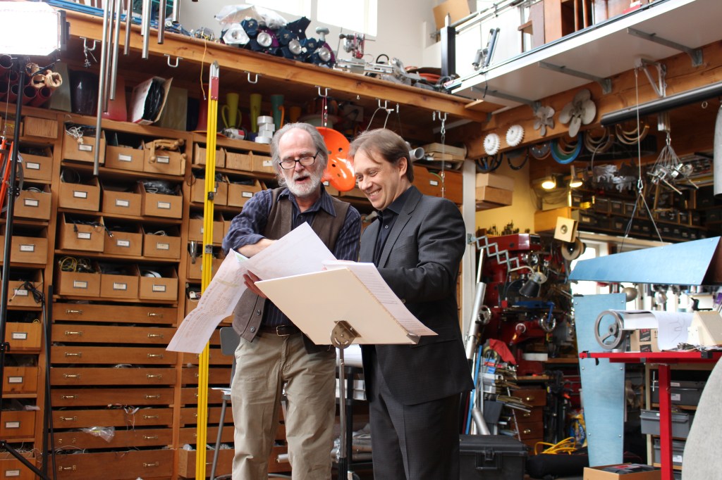 Above: Trimpin (left) with Morlot. Below: the score and prepared piano.Photos courtesy of Seattle Symphony Orchestra
