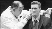 Richard Ziman (left) examines Jasiu (Ted deChatelet) in Polish Joke.
