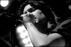 Julian Stroke gets ready to mosh.