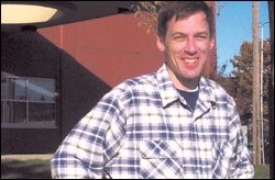 Chris Jackins in front of the $104 million Seattle School District headquarters.