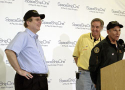 Starship Troopers: A rare smile from Paul signals success, thanks to aviation legend Burt Rutan, center, and rocketman Mike Melvill, right.