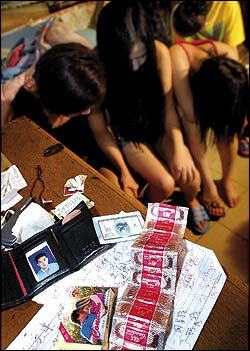 A brothel bust in China: While human trafficking takes many forms, the new abolition activists focus on "sex slavery," broadly defined as any form of prostitution, legal or illegal.