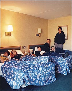 Left to right: Kurt Dahle, Neko Case, John Collins, Carl Newman, Blaine Thurier, and Todd Fancey (missing: Dan Bejar).