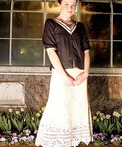 From Sweetie: Future Paradise lace skirt ($325); Future Paradise pintuck peplum blouse ($171). April May Clifford sterling silver and handmade glass necklace ($85, from Fancy).