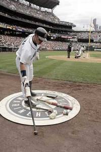 Kenji Johjima scratching some code in the dirt.