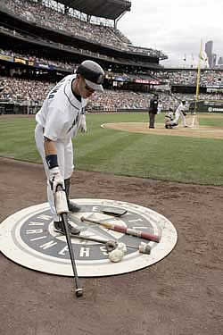 Kenji Johjima scratching some code in the dirt.