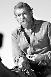 Brosnan trades his Aston Martin for a horse.